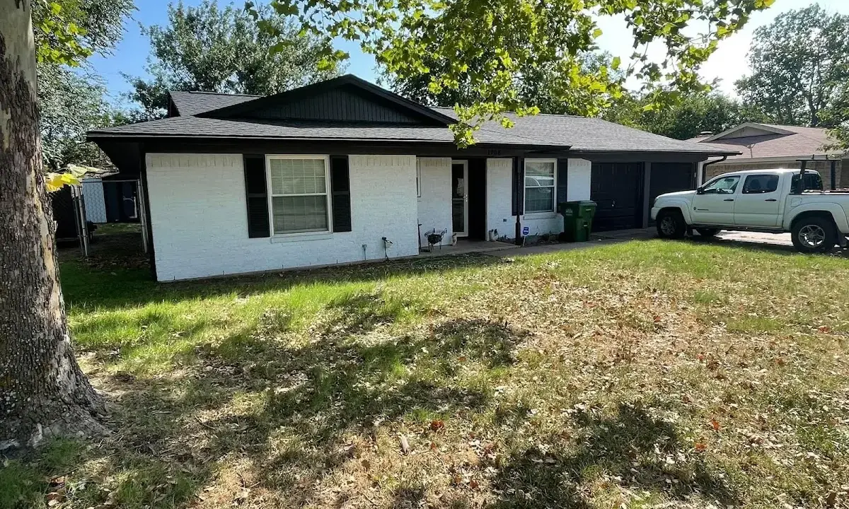 Professional roofing crew working on a residential roof in Leavenworth